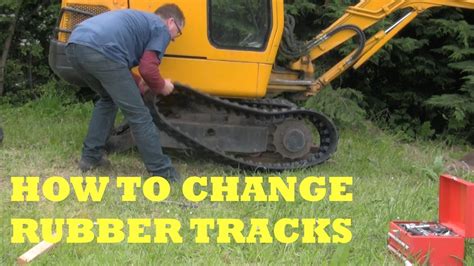 how to change a rubber track on a mini digger|rubber track replacement for mini.